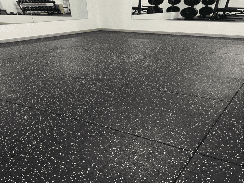 Close up of rubber gym floor texture with a shoe sole sticking to it